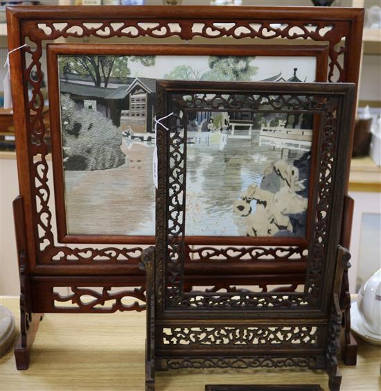 A Chinese pierced hardwood table screen with embroidered silk panel and a similar later screen